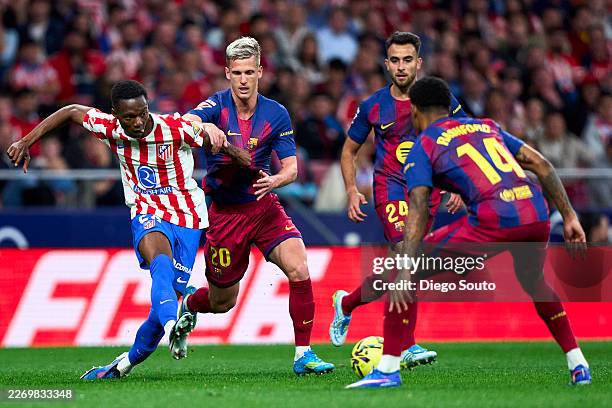MADRID, SPAIN - APRIL 04: Taufik Seidu of Atletico de Madrid battle for the ball with Dani Olmo of FC Barcelona during the LaLiga EA Sports match between Atletico de Madrid and FC Barcelona at Riyadh Air Metropolitano on April 04, 2026 in Madrid, Spain. (Photo by Diego Souto/Getty Images)