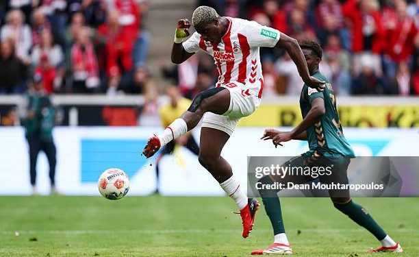 COLOGNE, GERMANY - APRIL 12: Ragnar Ache of 1. FC Koln scores his team's second goal during the Bundesliga match between 1. FC Köln and SV Werder Bremen at RheinEnergieStadion on April 12, 2026 in Cologne, Germany. (Photo by Dean Mouhtaropoulos/Getty Images)