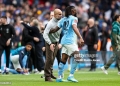 LONDON, ENGLAND - MAY 16: Head Coach Pep Guardiola with winning goal-scorer Antoine Semenyo of Manchester City after his sides 1-0 win during the Emirates FA Cup Final match between Chelsea and Manchester City on May 16, 2026 in London, England. (Photo by Robin Jones/Getty Images)