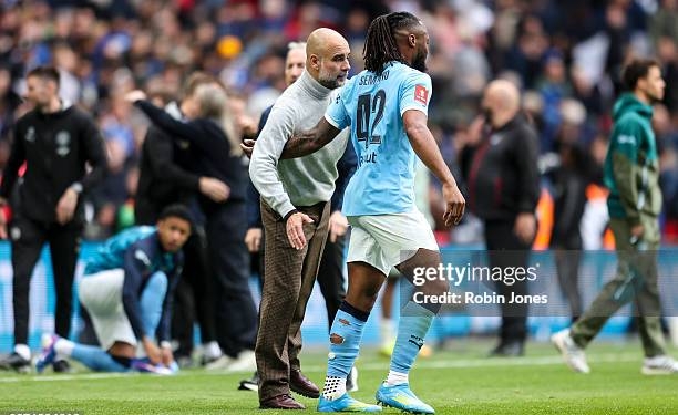 LONDON, ENGLAND - MAY 16: Head Coach Pep Guardiola with winning goal-scorer Antoine Semenyo of Manchester City after his sides 1-0 win during the Emirates FA Cup Final match between Chelsea and Manchester City on May 16, 2026 in London, England. (Photo by Robin Jones/Getty Images)
