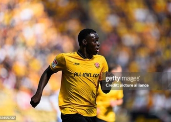 31 August 2025, Saxony, Dresden: Soccer: 2nd Bundesliga, SG Dynamo Dresden - FC Schalke 04, Matchday 4, Rudolf-Harbig-Stadion, Kofi Amoako (Dynamo Dresden) runs across the pitch. Photo: Robert Michael/dpa - IMPORTANT NOTE: In accordance with the regulations of the DFL German Football League and the DFB German Football Association, it is prohibited to utilize or have utilized photographs taken in the stadium and/or of the match in the form of sequential images and/or video-like photo series. (Photo by Robert Michael/picture alliance via Getty Images)