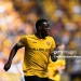 31 August 2025, Saxony, Dresden: Soccer: 2nd Bundesliga, SG Dynamo Dresden - FC Schalke 04, Matchday 4, Rudolf-Harbig-Stadion, Kofi Amoako (Dynamo Dresden) runs across the pitch. Photo: Robert Michael/dpa - IMPORTANT NOTE: In accordance with the regulations of the DFL German Football League and the DFB German Football Association, it is prohibited to utilize or have utilized photographs taken in the stadium and/or of the match in the form of sequential images and/or video-like photo series. (Photo by Robert Michael/picture alliance via Getty Images)