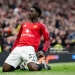 MANCHESTER, ENGLAND - MAY 3:   Kobbie Mainoo of Manchester United celebrates scoring a goal to make the score 3-2 during the Premier League match between Manchester United and Liverpool at Old Trafford on May 3, 2026 in Manchester, United Kingdom. (Photo by Ash Donelon/Manchester United via Getty Images)