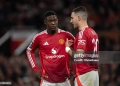MANCHESTER, ENGLAND - APRIL 17: Kobbie Mainoo of Manchester United speaks to team mate Diogo Dalot  during the UEFA Europa League 2024/25 Quarter Final Second Leg match between Manchester United and Olympique Lyonnais at Old Trafford on April 17, 2025 in Manchester, England. (Photo by Joe Prior/Visionhaus via Getty Images)