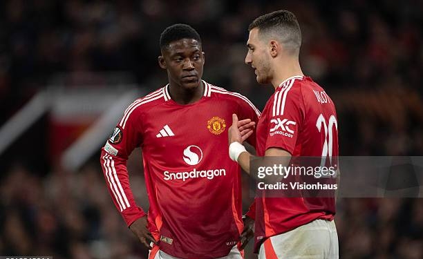 MANCHESTER, ENGLAND - APRIL 17: Kobbie Mainoo of Manchester United speaks to team mate Diogo Dalot  during the UEFA Europa League 2024/25 Quarter Final Second Leg match between Manchester United and Olympique Lyonnais at Old Trafford on April 17, 2025 in Manchester, England. (Photo by Joe Prior/Visionhaus via Getty Images)