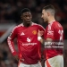 MANCHESTER, ENGLAND - APRIL 17: Kobbie Mainoo of Manchester United speaks to team mate Diogo Dalot  during the UEFA Europa League 2024/25 Quarter Final Second Leg match between Manchester United and Olympique Lyonnais at Old Trafford on April 17, 2025 in Manchester, England. (Photo by Joe Prior/Visionhaus via Getty Images)