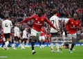 MANCHESTER, ENGLAND - MAY 03: Kobbie Mainoo of Manchester United celebrates scoring his team's third goal during the Premier League match between Manchester United and Liverpool at Old Trafford on May 03, 2026 in Manchester, England. (Photo by Shaun Botterill/Getty Images)