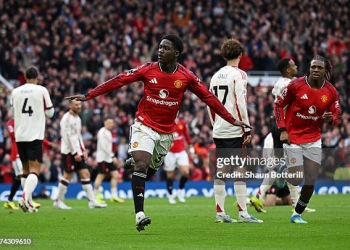 MANCHESTER, ENGLAND - MAY 03: Kobbie Mainoo of Manchester United celebrates scoring his team's third goal during the Premier League match between Manchester United and Liverpool at Old Trafford on May 03, 2026 in Manchester, England. (Photo by Shaun Botterill/Getty Images)