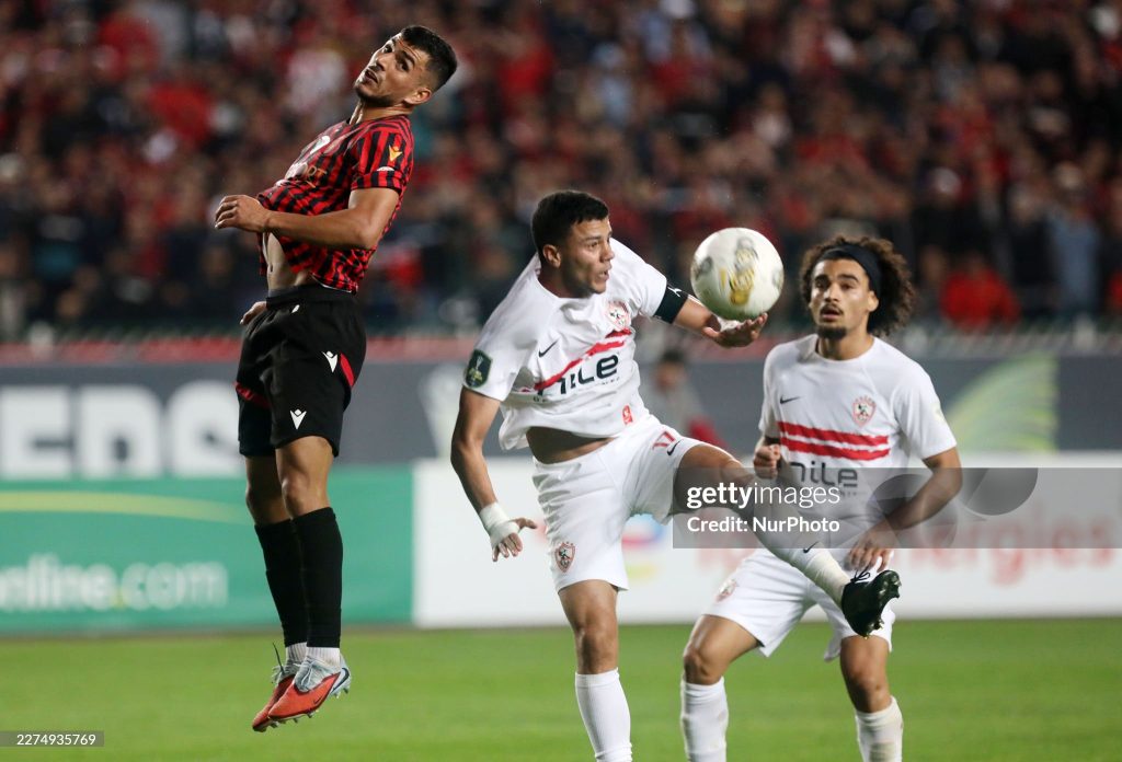 Zakaria Draoui of USM Alger (left) competes for the ball with Mohamed Mohamed Shehata Mahmoud of Zamalek SC during the first leg of the CAF Confederation Cup final between USM Alger and Zamalek SC at the July 5 Stadium in Algiers, Algeria, on May 9, 2025. (Photo by Billel Bensalem/APP/NurPhoto via Getty Images)
