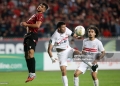 Zakaria Draoui of USM Alger (left) competes for the ball with Mohamed Mohamed Shehata Mahmoud of Zamalek SC during the first leg of the CAF Confederation Cup final between USM Alger and Zamalek SC at the July 5 Stadium in Algiers, Algeria, on May 9, 2025. (Photo by Billel Bensalem/APP/NurPhoto via Getty Images)
