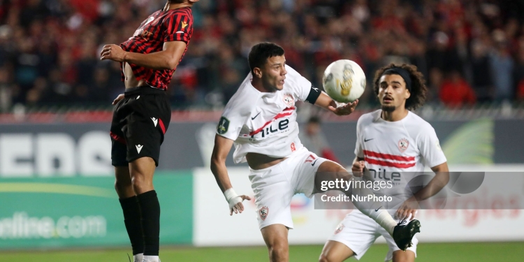Zakaria Draoui of USM Alger (left) competes for the ball with Mohamed Mohamed Shehata Mahmoud of Zamalek SC during the first leg of the CAF Confederation Cup final between USM Alger and Zamalek SC at the July 5 Stadium in Algiers, Algeria, on May 9, 2025. (Photo by Billel Bensalem/APP/NurPhoto via Getty Images)