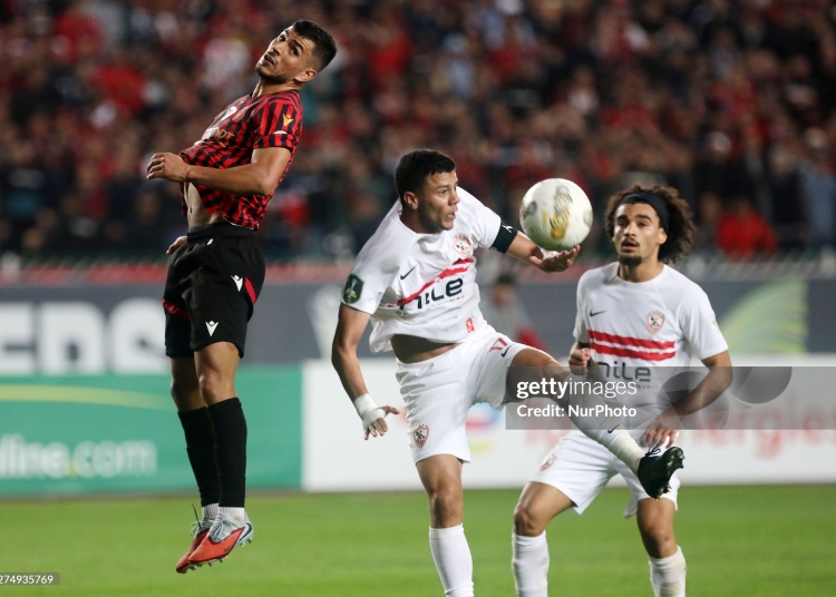 Zakaria Draoui of USM Alger (left) competes for the ball with Mohamed Mohamed Shehata Mahmoud of Zamalek SC during the first leg of the CAF Confederation Cup final between USM Alger and Zamalek SC at the July 5 Stadium in Algiers, Algeria, on May 9, 2025. (Photo by Billel Bensalem/APP/NurPhoto via Getty Images)