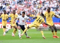 FOXBOROUGH, MASSACHUSETTS - JUNE 23: Jude Bellingham #10 of England is challenged by Gideon Mensah #14 of Ghana during the FIFA World Cup 2026 Group L match between England and Ghana at Boston Stadium on June 23, 2026 in Foxborough, Massachusetts. (Photo by Buda Mendes/Getty Images)