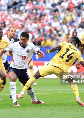 FOXBOROUGH, MASSACHUSETTS - JUNE 23: Jude Bellingham #10 of England is challenged by Gideon Mensah #14 of Ghana during the FIFA World Cup 2026 Group L match between England and Ghana at Boston Stadium on June 23, 2026 in Foxborough, Massachusetts. (Photo by Buda Mendes/Getty Images)