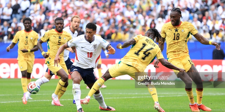 FOXBOROUGH, MASSACHUSETTS - JUNE 23: Jude Bellingham #10 of England is challenged by Gideon Mensah #14 of Ghana during the FIFA World Cup 2026 Group L match between England and Ghana at Boston Stadium on June 23, 2026 in Foxborough, Massachusetts. (Photo by Buda Mendes/Getty Images)