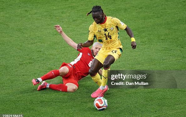 TORONTO, ONTARIO - JUNE 17: Gideon Mensah #14 of Ghana is  tackled by Cristian Martinez #6 of Panama during the FIFA World Cup 2026 Group L match between Ghana and Panama at Toronto Stadium on June 17, 2026 in Toronto, Ontario. (Photo by Dan Mullan/Getty Images)