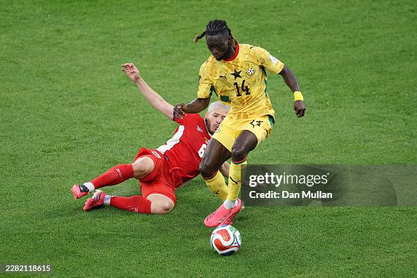 TORONTO, ONTARIO - JUNE 17: Gideon Mensah #14 of Ghana is tackled by Cristian Martinez #6 of Panama during the FIFA World Cup 2026 Group L match between Ghana and Panama at Toronto Stadium on June 17, 2026 in Toronto, Ontario. (Photo by Dan Mullan/Getty Images)