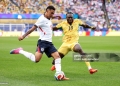 FOXBOROUGH, MASSACHUSETTS - JUNE 23: Morgan Rogers #17 of England controls the ball against Jerome Opoku #18 of Ghana  during the FIFA World Cup 2026 Group L match between England and Ghana at Boston Stadium on June 23, 2026 in Foxborough, Massachusetts. (Photo by Justin Setterfield/Getty Images)