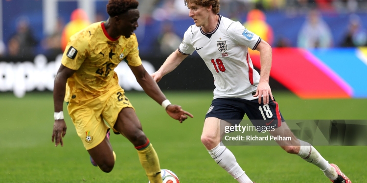 FOXBOROUGH, MASSACHUSETTS - JUNE 23: Anthony Gordon #18 of England takes on Marvin Senaya #26 of Ghana during the FIFA World Cup 2026 Group L match between England and Ghana at Boston Stadium on June 23, 2026 in Foxborough, Massachusetts. (Photo by Richard Pelham/Getty Images)