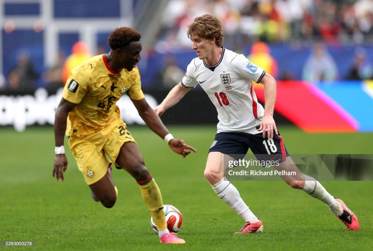 FOXBOROUGH, MASSACHUSETTS - JUNE 23: Anthony Gordon #18 of England takes on Marvin Senaya #26 of Ghana during the FIFA World Cup 2026 Group L match between England and Ghana at Boston Stadium on June 23, 2026 in Foxborough, Massachusetts. (Photo by Richard Pelham/Getty Images)