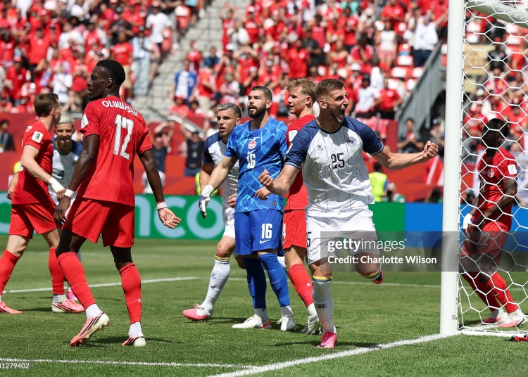 TORONTO, ONTARIO - JUNE 12: Jovo Lukic #25 of Bosnia and Herzegovina celebrates scoring his team's first goal during the FIFA World Cup 2026 Group B match between Canada and Bosnia and Herzegovina at Toronto Stadium on June 12, 2026 in Toronto, Ontario. (Photo by Charlotte Wilson/Getty Images)