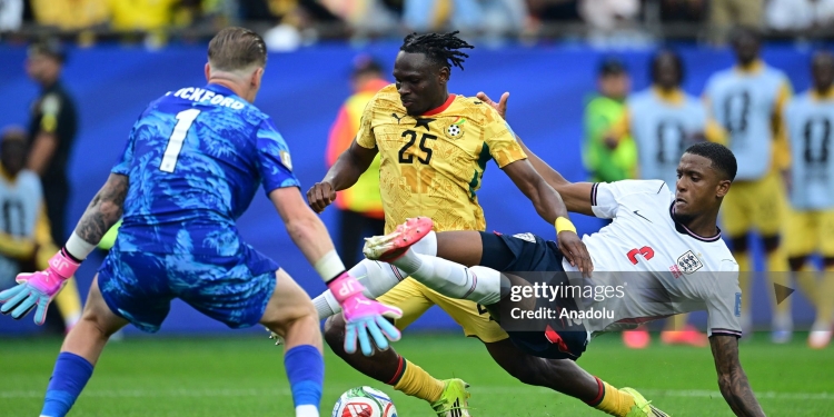 FOXBOROUGH, USA - JUNE 23: Prince Kwabena Adu (25) of Ghana in action against Ezri Konsa (2) of England during the 2026 FIFA World Cup First Stage Group L match between England and Ghana at Gillette Stadium (Boston Stadium) in Foxborough, Massachusetts, United States on June 23, 2026. (Photo by Abdulhamid Hosbas/Anadolu via Getty Images)