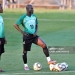 Ghana's midfielder Stephen Appiah (C) and midfielder Sulley Muntari (L) stand on the pitch as they take part in a training session at Mogwase stadium in Mogwase, north of Rustenburg, on June 10, 2010 ahead of the start of the 2010 World Cup football tournament.  The 2010 World Cup will take place in South Africa from June 11 to July 11, the first time on African soil for the biggest and most prestigious competition in sport.   AFP PHOTO / JUNG YEON-JE (Photo by JUNG YEON-JE / AFP via Getty Images)