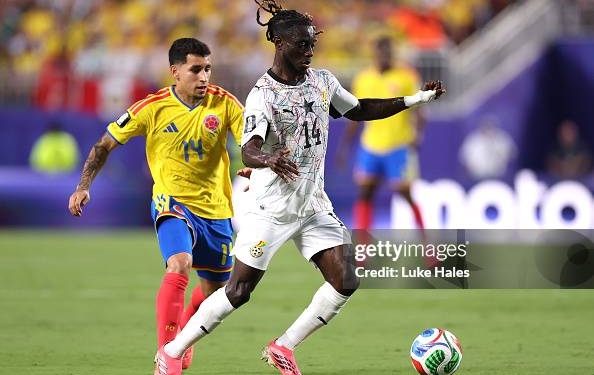 KANSAS CITY, MISSOURI - JULY 03: Gideon Mensah #14 of Ghana controls the ball under pressure from Gustavo Puerta #14 of Colombia during the FIFA World Cup 2026 Round of 32 match between Colombia and Ghana at Kansas City Stadium on July 03, 2026 in Kansas City, Missouri. (Photo by Luke Hales/Getty Images)