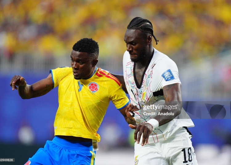 KANSAS CITY, UNITED STATES - JULY 3: Jhon Cordoba (9) of Colombia in action against Jerome Opoku (R) of Ghana during the 2026 FIFA World Cup Round of 32 match between Colombia and Ghana at Arrowhead Stadium (Kansas City Stadium) in Kansas City, Missouri, United States on July 3, 2026. (Photo by Hakan Akgun/Anadolu via Getty Images)