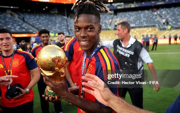 EAST RUTHERFORD, NEW JERSEY - JULY 19: Nico Williams #17 of Spain celebrates with the FIFA World Cup Winner’s Trophy after the team’s victory following the FIFA World Cup 2026 Final match between Spain and Argentina at New York New Jersey Stadium on July 19, 2026 in East Rutherford, New Jersey. (Photo by Hector Vivas - FIFA/FIFA via Getty Images)