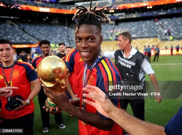 EAST RUTHERFORD, NEW JERSEY - JULY 19: Nico Williams #17 of Spain celebrates with the FIFA World Cup Winner’s Trophy after the team’s victory following the FIFA World Cup 2026 Final match between Spain and Argentina at New York New Jersey Stadium on July 19, 2026 in East Rutherford, New Jersey. (Photo by Hector Vivas - FIFA/FIFA via Getty Images)
