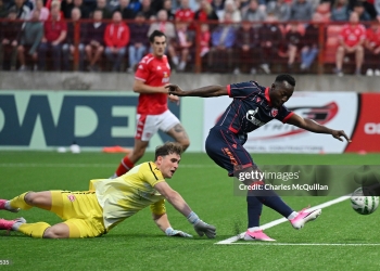 LARNE, NORTHERN IRELAND - JULY 21: Osman Bukari of Red Star Belgrade shoots past Rohan Ferguson of Larne during the UEFA Champions League 2026/27 second qualifying round first leg match between Larne and Red Star Belgrade at Inver Park on July 21, 2026 in Larne, Northern Ireland. (Photo by Charles McQuillan/Getty Images)