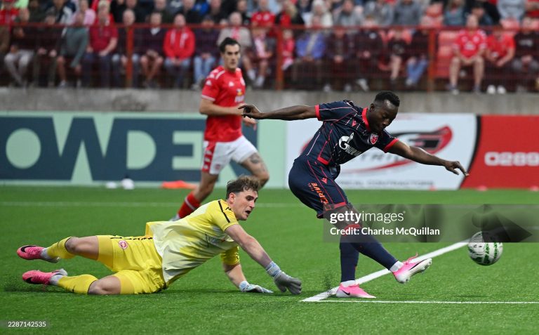 LARNE, NORTHERN IRELAND - JULY 21: Osman Bukari of Red Star Belgrade shoots past Rohan Ferguson of Larne during the UEFA Champions League 2026/27 second qualifying round first leg match between Larne and Red Star Belgrade at Inver Park on July 21, 2026 in Larne, Northern Ireland. (Photo by Charles McQuillan/Getty Images)