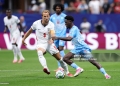 ATLANTA, GEORGIA - JULY 01: Nathanael Mbuku #7 of Congo DR controls the ball against Harry Kane #9 of England during the FIFA World Cup 2026 Round Of 32 match between England and Congo DR at Atlanta Stadium on July 01, 2026 in Atlanta, Georgia. (Photo by Darrian Traynor/Getty Images)