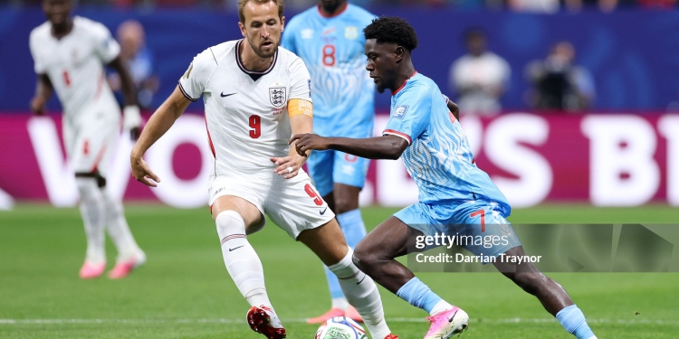 ATLANTA, GEORGIA - JULY 01: Nathanael Mbuku #7 of Congo DR controls the ball against Harry Kane #9 of England during the FIFA World Cup 2026 Round Of 32 match between England and Congo DR at Atlanta Stadium on July 01, 2026 in Atlanta, Georgia. (Photo by Darrian Traynor/Getty Images)