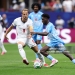 ATLANTA, GEORGIA - JULY 01: Nathanael Mbuku #7 of Congo DR controls the ball against Harry Kane #9 of England during the FIFA World Cup 2026 Round Of 32 match between England and Congo DR at Atlanta Stadium on July 01, 2026 in Atlanta, Georgia. (Photo by Darrian Traynor/Getty Images)