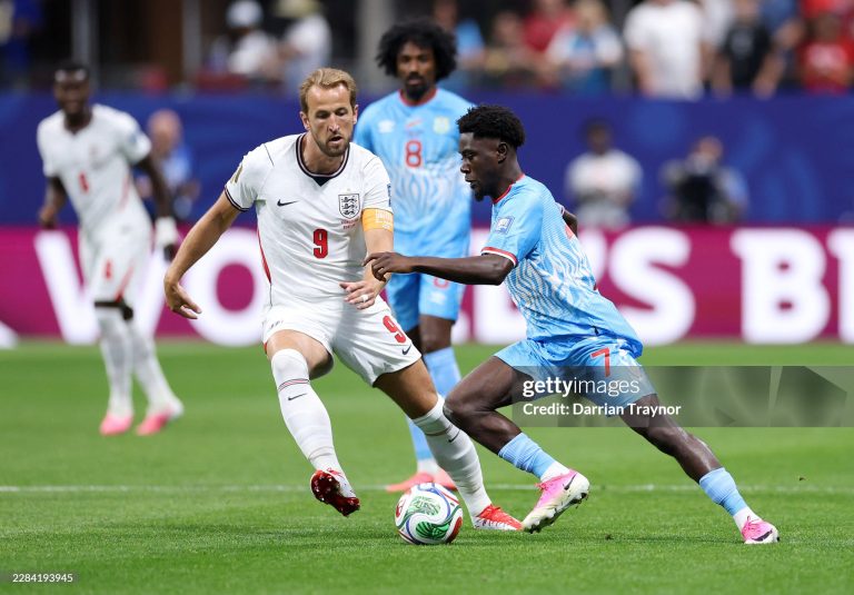 ATLANTA, GEORGIA - JULY 01: Nathanael Mbuku #7 of Congo DR controls the ball against Harry Kane #9 of England during the FIFA World Cup 2026 Round Of 32 match between England and Congo DR at Atlanta Stadium on July 01, 2026 in Atlanta, Georgia. (Photo by Darrian Traynor/Getty Images)