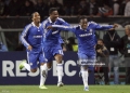 Chelsea's Ivorian forward Didier Drogba (L) and team mate John Obi Mikel (C) celebrate with Ghanian midfielder Michael Essien after he scored against Juventus during their Champions League second leg first knockout round football match on March 10, 2009 at Olympic Stadium in Turin.      AFP PHOTO / ADRIAN DENNIS (Photo by ADRIAN DENNIS / AFP via Getty Images)