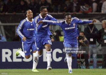 Chelsea's Ivorian forward Didier Drogba (L) and team mate John Obi Mikel (C) celebrate with Ghanian midfielder Michael Essien after he scored against Juventus during their Champions League second leg first knockout round football match on March 10, 2009 at Olympic Stadium in Turin.      AFP PHOTO / ADRIAN DENNIS (Photo by ADRIAN DENNIS / AFP via Getty Images)