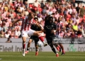 STOKE ON TRENT, ENGLAND - AUGUST 15:  Stoke City's Svante Ingelsson shields the ball from Swansea City's Joseph Opoku during the Sky Bet Championship 2026/27 match between Stoke City and Swansea City at Bet365 Stadium on August 15, 2026 in Stoke on Trent, England. (Photo by Stephen White - CameraSport via Getty Images)
