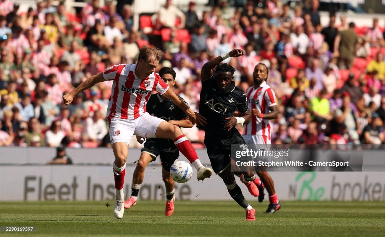 STOKE ON TRENT, ENGLAND - AUGUST 15: Stoke City's Svante Ingelsson shields the ball from Swansea City's Joseph Opoku during the Sky Bet Championship 2026/27 match between Stoke City and Swansea City at Bet365 Stadium on August 15, 2026 in Stoke on Trent, England. (Photo by Stephen White - CameraSport via Getty Images)