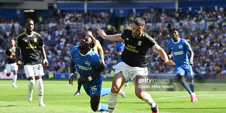 BRIGHTON, ENGLAND - AUGUST 23: Ibrahim Osman of Brighton and Hove Albion is tackled by John McGinn of Aston Villa during the Premier League 2026/27 match between Brighton & Hove Albion and Aston Villa FC at American Express Stadium on August 23, 2026 in Brighton, England. (Photo by Mike Hewitt/Getty Images)