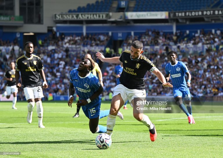 BRIGHTON, ENGLAND - AUGUST 23: Ibrahim Osman of Brighton and Hove Albion is tackled by John McGinn of Aston Villa during the Premier League 2026/27 match between Brighton & Hove Albion and Aston Villa FC at American Express Stadium on August 23, 2026 in Brighton, England. (Photo by Mike Hewitt/Getty Images)