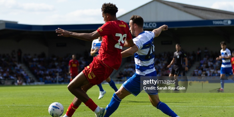 WIMBLEDON, ENGLAND - AUGUST 1: Harvey Vale of Queens Park Rangers tackles Aron Sasu of AFC Wimbledon during the pre-season friendly match between AFC Wimbledon and Queens Park Rangers at The Cherry Red Records Stadium on August 1, 2026 in Wimbledon, England. (Photo by Sarah Ray-Gain/Getty Images)