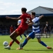 WIMBLEDON, ENGLAND - AUGUST 1: Harvey Vale of Queens Park Rangers tackles Aron Sasu of AFC Wimbledon during the pre-season friendly match between AFC Wimbledon and Queens Park Rangers at The Cherry Red Records Stadium on August 1, 2026 in Wimbledon, England. (Photo by Sarah Ray-Gain/Getty Images)