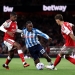 LONDON, ENGLAND - AUGUST 21: Brandon Thomas-Asante of Coventry City is challenged by Cristhian Mosquera and Ben White of Arsenal during the Premier League 2026/27 match between Arsenal FC and Coventry City at Emirates Stadium on August 21, 2026 in London, England. (Photo by Julian Finney/Getty Images)
