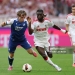 COLOGNE, GERMANY - AUGUST 29: Patrick Wimmer of TSG 1899 Hoffenheim is challenged by Gideon Mensah of 1.FC Koln during the Bundesliga 2026/27 match between 1. FC Köln and TSG Hoffenheim at RheinEnergieStadion on August 29, 2026 in Cologne, Germany. (Photo by Lars Baron/Getty Images)
