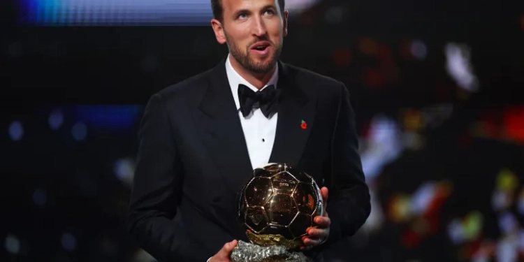 Bayern Munich's Harry Kane celebrates after winning the men's Ballon d'Or award [Matthew Childs/Action Images via Reuters]