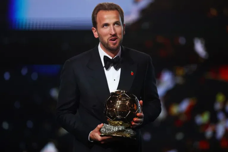 Bayern Munich's Harry Kane celebrates after winning the men's Ballon d'Or award [Matthew Childs/Action Images via Reuters]