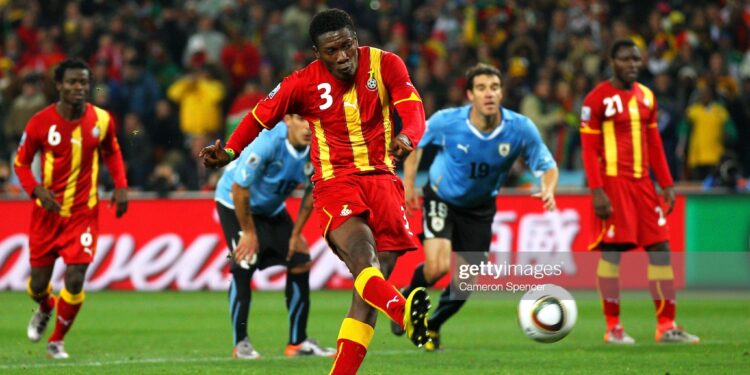 JOHANNESBURG, SOUTH AFRICA - JULY 02: Asamoah Gyan of Ghana shoots a late penalty high during the 2010 FIFA World Cup South Africa Quarter Final match between Uruguay and Ghana at the Soccer City stadium on July 2, 2010 in Johannesburg, South Africa. (Photo by Cameron Spencer/Getty Images)